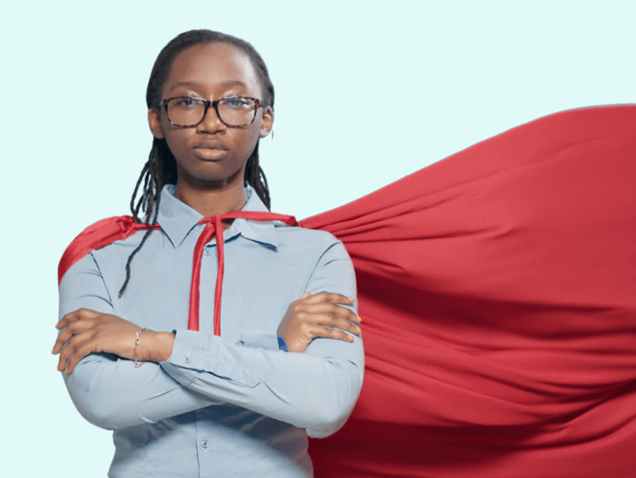 A female hero wearing a red cape