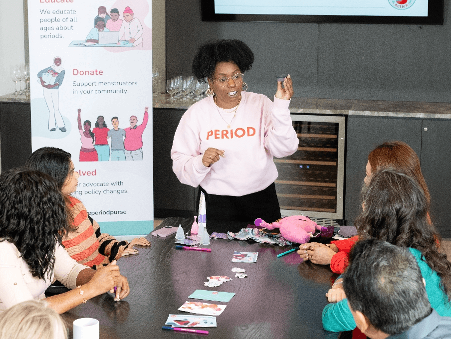 A Period Purse volunteer holding a seminar with adult participants