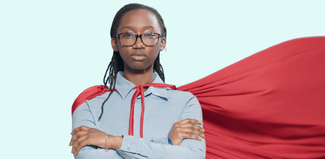 A female hero wearing a red cape