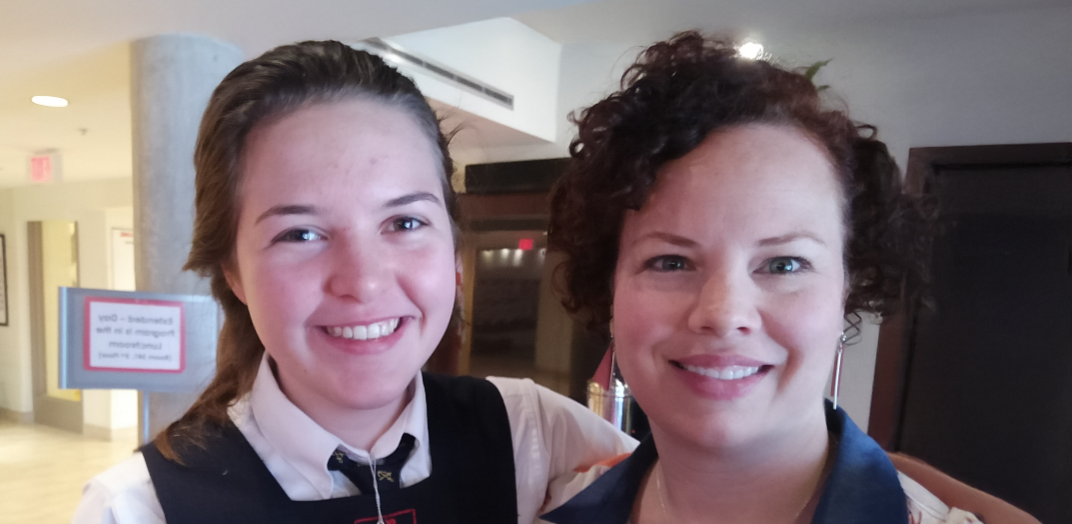 A smilling woman and student