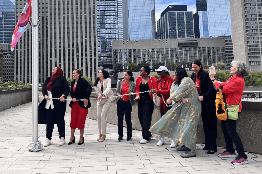 TPP volunteers pulling together to raise a flag