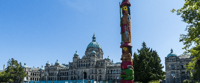 The parliament building with an indigenous pole