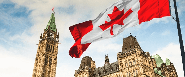 The parliament building with Canadian flag raised