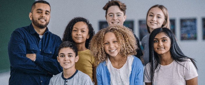 A group of high school students and their teacher