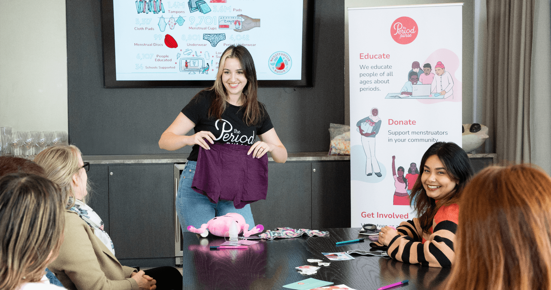 A woman doing a presentation of period related products