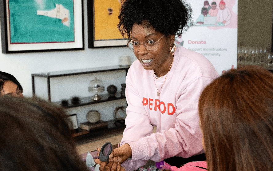 A TPP volunteer talking to students