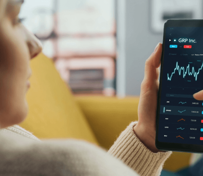 A person looking at a stock chart on a phone