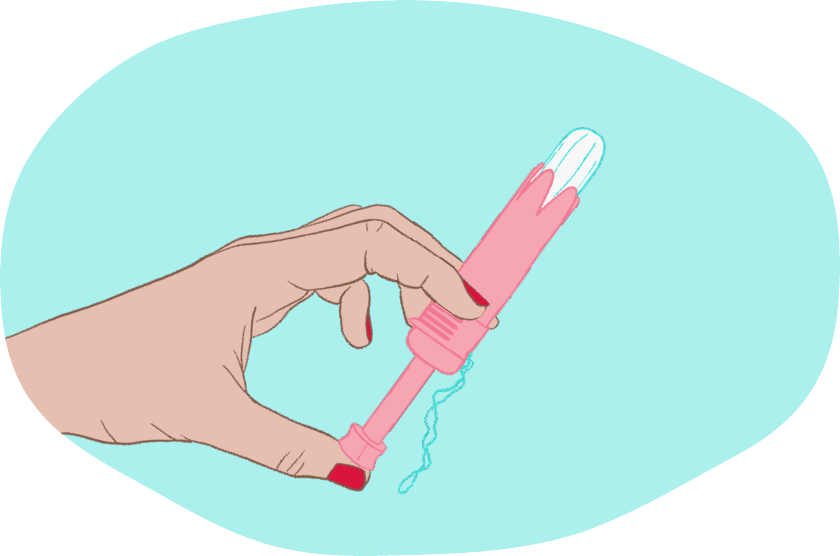 A female hand holding a period product